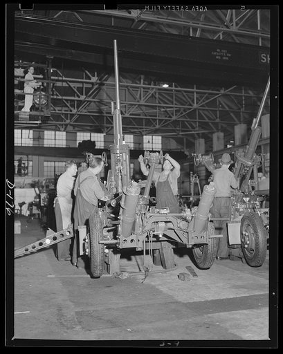 Protection piece. The finished assembly of a 37 mm anti-aircraft gun carriage receives final adjustments in an eastern arsenal