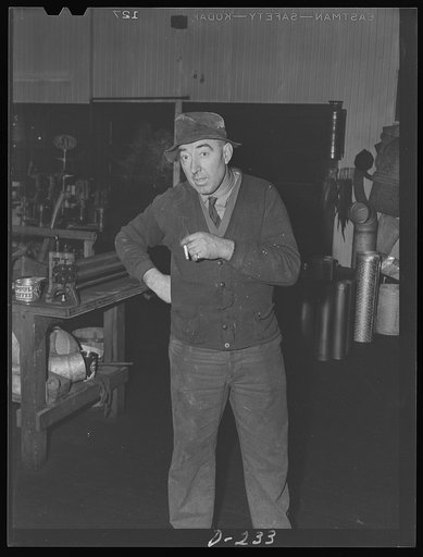 Worker of J.E. Goode and Sons, Harrisonburg, takes time out for relaxation. This is one of the flourishing shops in the Valley