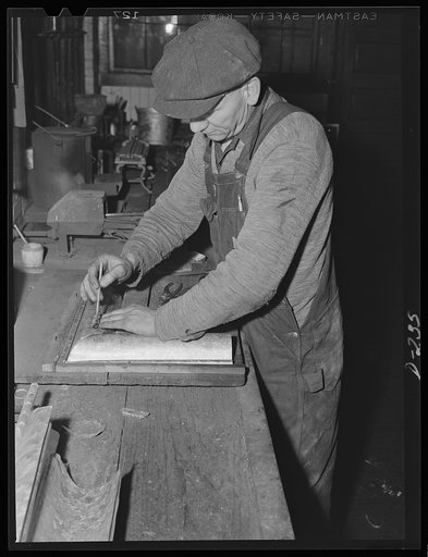 Tinsmith at work in drainpipe section in one of the flourishing shops in the Shenandoah Valley