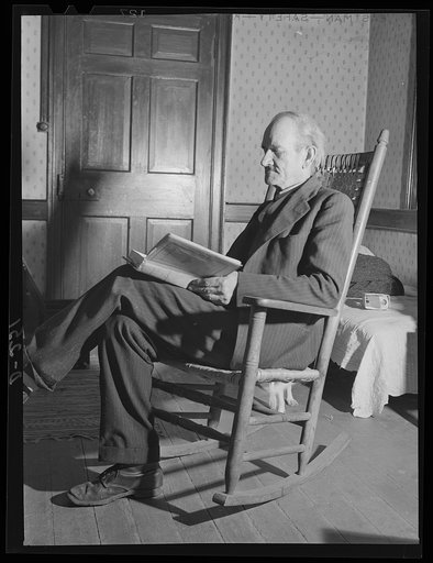 Shenandoah Valley. Mr. McGahey reading in the front room of his century-old house
