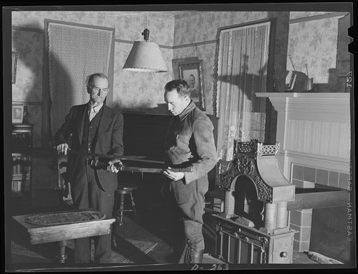 Shenandoah Valley. Mr. McGahey showing P.M. Carper, assistant county agent for Rockingham County, sword and scabbard which were manufactured on the place for the Confederacy