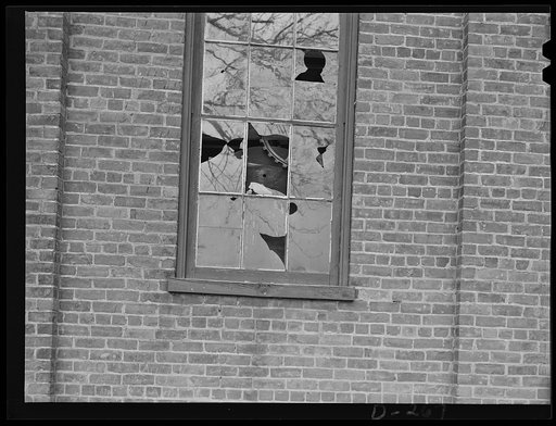 Shenandoah Valley. Broken windows of the Penn Foundry Manufacturing Company at Waynesboro, Virginia. Three cavernous buildings filled with moldering machinery. Inhabited only by flocks of pigeons who nest among the unused pulley belts