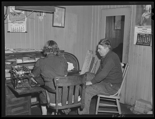 Shenandoah Valley. Wilbarger doing paperwork in his tiny office. His sister, Mary, comes in to do the clerical details