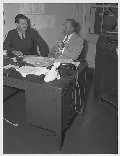 R.J. Lund, consultant on miscellaneous minerals, Materials Branch, Production Management (right). Robert H. Ridgway (left), consultant for scrap iron and steel, Materials Branch, Production Division