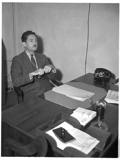 Earl M. McGowin, assistant consultant, lumber and timber products, Production Division