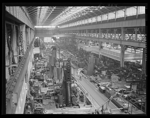 "Tooled Up" with somewhere to go. Part of the vast machine shop at an eastern Navy yard, where machine-tools that took months to build are now stepping out with production parts and materials needed for Navy expansion