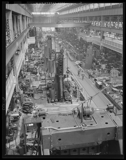 "Tooled Up" with somewhere to go. Part of the vast machine shop at an eastern Navy yard, where machine-tools that took months to build are now stepping out with production parts and materials needed for Navy expansion