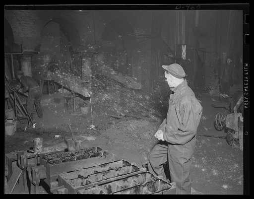 Like stars for the flag. Glistening sparks, like the constellation in the blue field of Old Glory, issue from a semi-steel heating operation at an eastern Navy yard