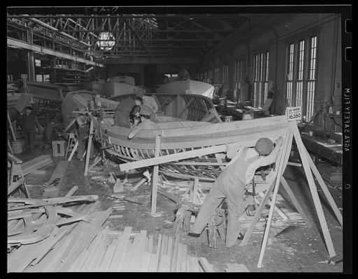 Minor unit for the U.S. fleet. Building 26-foot whaleboats in the shipright shop at an eastern Navy yard. Large numbers of these craft are under construction as auxiliaries for the two-ocean Navy