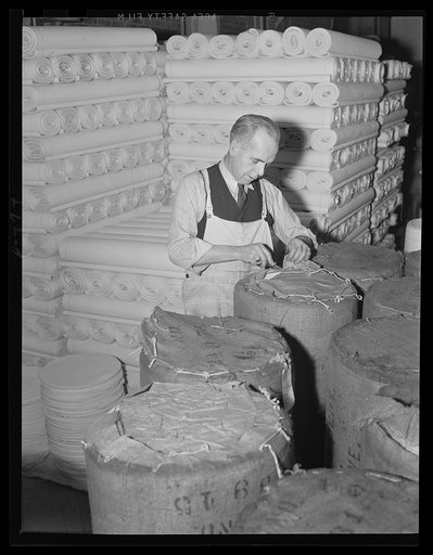 Stout cloth for a stout purpose. Bolts of canvas, piled high at an eastern Navy yard will soon be turned in deck awnings, hammocks and accessories as our Fleet grows into a two-ocean Navy