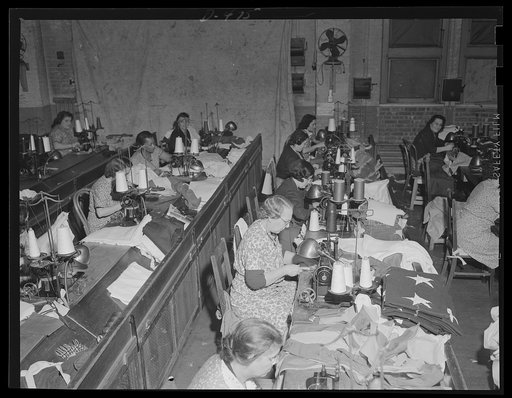 Stout cloth for a stout purpose. Bolts of canvas, piled high at an eastern Navy yard will soon be turned in deck awnings, hammocks and accessories as our Fleet grows into a two-ocean Navy
