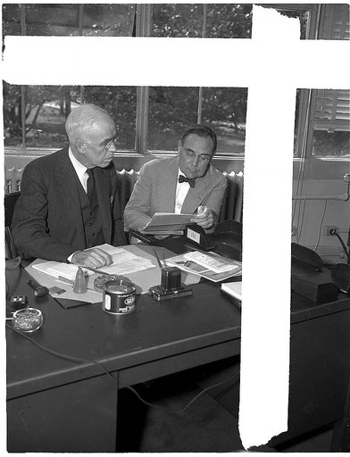 R.C. Allen, Consultant, Ferrous Minerals and Alloys, Production Division (right), and Dr. C.K. Leith, Consultant on Minerals, Office of Production Management (OPM). Formerly professor in Geology at University of Wisconsin (still)