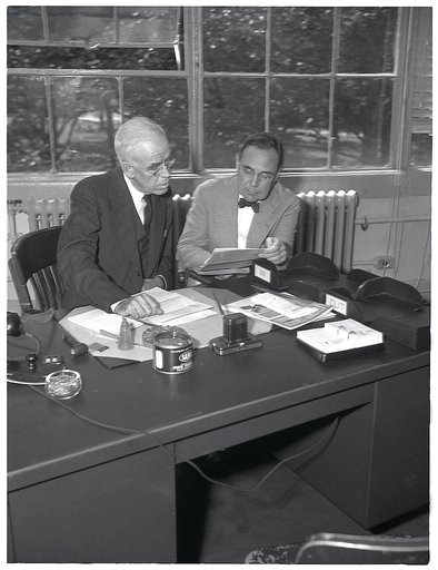 R.C. Allen, Consultant, Ferrous Mineral and Alloys Production Division (right), and Dr. C.K. Leith, Consultant on Minerals, Office of Production Management (OPM). Formerly professor in Geology at the University of Wisconsin (still)