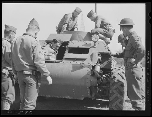 Soldiers inspecting new trackless tank during demonstration at Fort Myer, Virginia. Tank was manufactured by the Trackless Tank Corporation of New York, and submitted to the Ordnance Department, U.S. Army, for inspection. Preliminary tests indicate that the tank may be adaptable for reconnaissance p