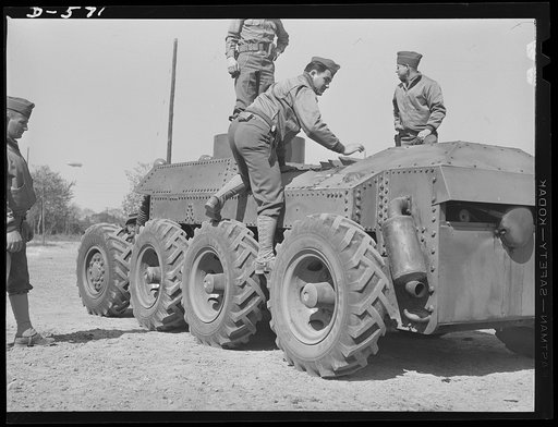 Soldiers inspecting new trackless tank during demonstration at Fort Myer, Virginia. Tentative plans call for a redesign of the tank's superstructure so that it may be adapted to suitable armament. For further data see caption for pix D-570