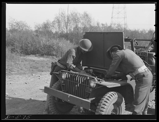 Soldier inspecting new bantam truck at Fort Myer, Virginia. This small light truck, known officially as the "Truck 1/4-ton 4x4," is a small, low-silhouette, narrow-tread, 4-wheel drive car without armor protection, which is designed to carry three men and their individual weapons. It can also be use