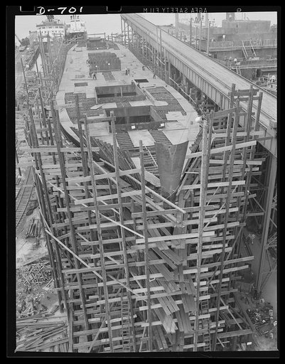 Newport News, Virginia. A C-3 ship under construction. This one is being built for the American President lines. The bow stem section has just been installed. This ship is about thirty percent completed