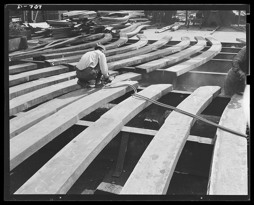 Newport News, Virginia. Cutter working on frame shapes with an oxyacetylene torch. These frame shapes are used for the ribs of a ship