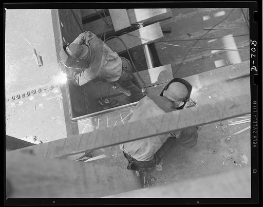 Newport News, Virginia. Electro-welder working on a hatch combing