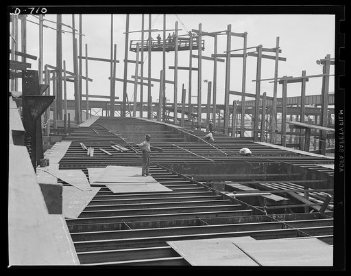 Newport News, Virginia. B-deck construction on a C-3 ship for the American President lines. The deck cross-members have been completed here and the deck flooring is about to be out on