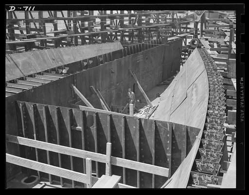 Newport News, Virginia. The stern quarter in the bottom of the hold of a C-3 watertight bulkhead is visible in the foreground