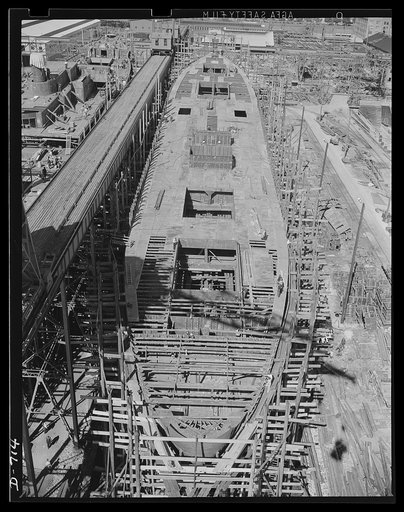Newport News, Virginia. A general deck view of a C-3 being built for the American President lines. The deck flooring is almost complete. That in the background of this photograph has been completed, that in the foreground is still being laid