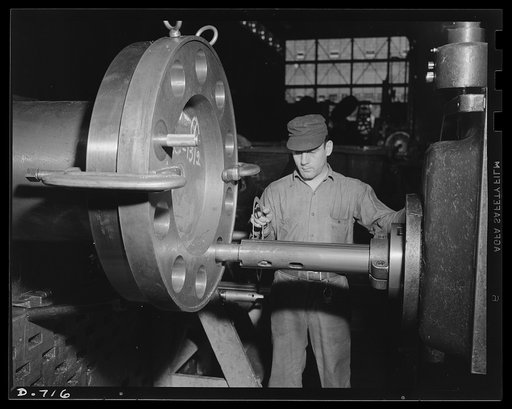 Newport News, Virginia. Worker boring and facing an engine shaft coupling