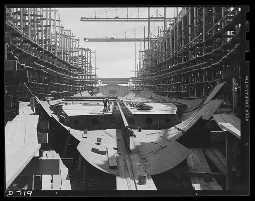 Newport News, Virginia. Hull of a C-3. The keel has recently been laid and the installation of a double-bottom section is in progress