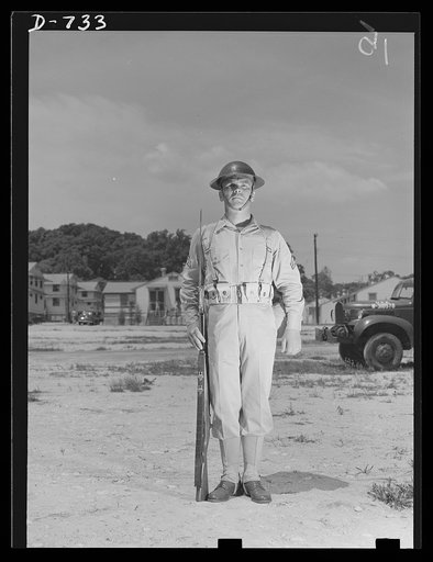 New Army helmet. Corporal French L. Vineyard, Company M, 12th Infantry. Wearing combat pack, uniform, and old "basin type" helmet. Arlington Cantonment, Arlington, Virginia