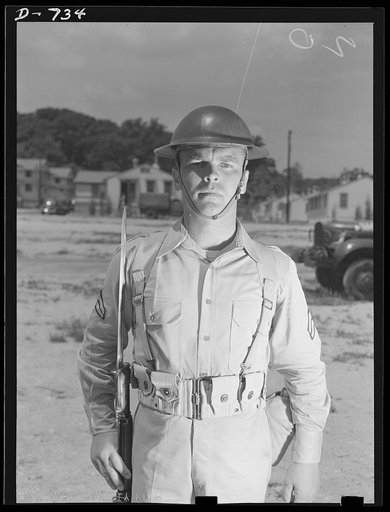 New Army helmet. Corporal French L. Vineyard, Company M, 12th Infantry. Wearing combat pack, uniform, and old "basin type" helmet. Arlington Cantonment, Arlington, Virginia
