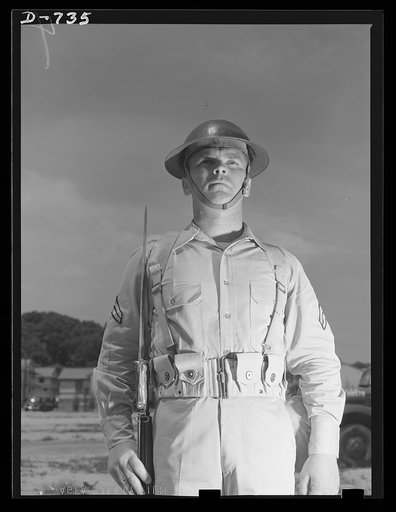 New Army helmet. Corporal French L. Vineyard, Company M, 12th Infantry. Wearing combat pack, uniform, and old "basin type" helmet. Arlington Cantonment, Arlington, Virginia
