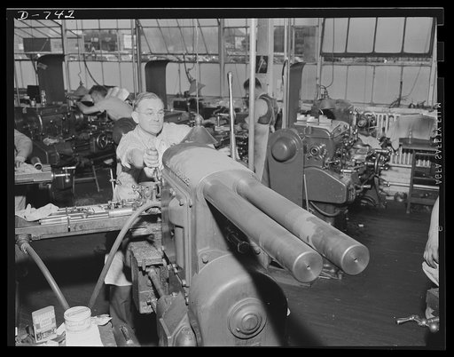 A machinist operating a small milling machine. This milling machine is a machine tool used to turn out parts for shell machine. Plant of Frederick Colman & Sons, Inc., Detroit, Michigan