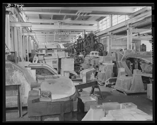 View of the die shop at the plant of Frederick Colman & Sons, Inc., Detroit, Michigan. The parts on the floor are waiting to be processed