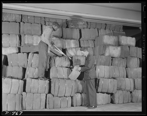Crude rubber, baled, in the storage room. This rubber will be used to make automobile tires and tubes. Ford River Rouge plant