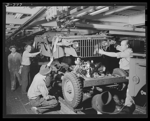 Blitz buggies. After the motor has been placed in the chassis and its connections made, the body is lowered into plane. Ford River Rouge plant