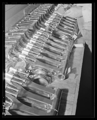 Finished connecting rods ready to be assembled to the crankshaft of a marine engine. Packard marine engine plant, Detroit