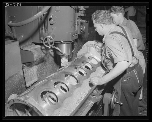 Milling the sides of the upper half of an aluminum crankcase for the Packard marine engine. Packard marine engine plant, Detroit