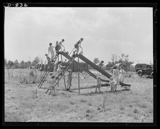 Defense housing, Erie, Pennsylvania. A large playground with slides and swings is provided for children of the defense trailer camp. Proceeds from candy and cigarette vending machines located in the central utility buildings maintain the playground
