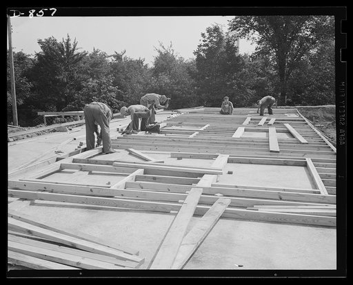 Defense housing, Erie, Pennsylvania. The entire framework, including sections for doors and windows, is fabricated horizontally. The crew working here will later move to another site and repeat the procedure. This circulation of crews who are experienced in one type of construction adds to the speed