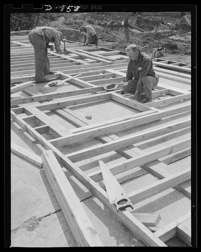 Defense housing, Erie, Pennsylvania. The entire framework, including sections for doors and windows, is fabricated horizontally. The crew working here will later move to another site and repeat the procedure. This circulation of crews who are experienced in one type of construction adds to the speed