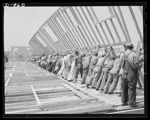 War Housing, Erie, Pennsylvania. The entire framework, including sections for doors and windows, is fabricated horizontally. The crew working here will later move to another site and repeat the procedure. This circulation of crews who are experienced in one type of construction adds to the speed wit