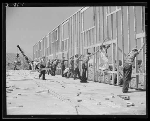 Defense housing, Erie, Pennsylvania. The entire framework, including sections for doors and windows, is fabricated horizontally. The crew working here will later move to another site and repeat the procedure. This circulation of crews who are experienced in one type of construction adds to the speed