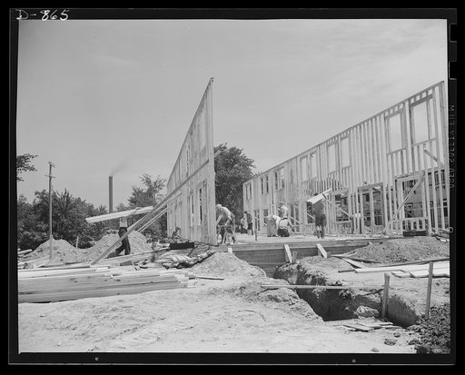 Defense housing, Erie, Pennsylvania. The entire framework, including sections for doors and windows, is fabricated horizontally. The crew working here will later move to another site and repeat the procedure. This circulation of crews who are experienced in one type of construction adds to the speed