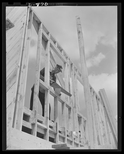 Defense housing, Erie, Pennsylvania. In tight corners the old hand saw still finds a spot. Pre-fabricating is not carried to time-wasting extremes, and there are a few places where hand cutting on the spot can do the job faster