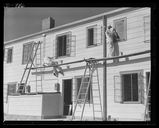 Defense housing, Erie, Pennsylvania. Painters finished up window frames on defense homes in Erie, Pennsylvania. No painting is required on the cement-asbestos shingles, since their natural finish is light, durable and attractive