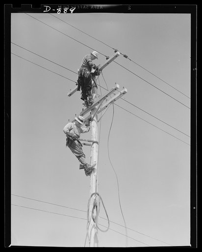 Defense housing, Erie, Pennsylvania. Electricians wiring defense homes at Franklin Terrace housing project. Defense homes are provided with electricity, sewage, police and fire protection. In many cases, a lump sum for all services is paid to the city in lieu of taxes