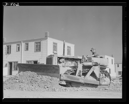 Defense housing, Erie, Pennsylvania. The Franklin Terrace defense housing project at Erie, Pennsylvania is completed with spacious, wide-paved streets. Because of its size (300 homes are being constructed) the most modern road building machinery was used throughout. Here a street is carefully graded