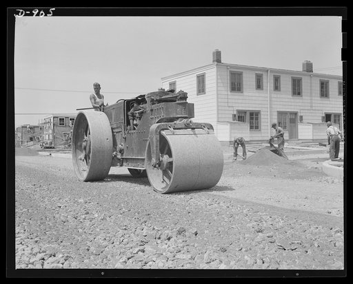 Defense housing, Erie, Pennsylvania. The filling materials are carefully rolled to provide a firm foundation for the paved streets