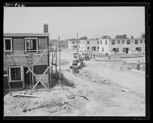 Defense housing, Erie, Pennsylvania. Progress reports at the Franklin Terrace defense housing project. Shown here are some of the 300 homes in various stages of completion. Road beds are being graded to serve the completed homes at the right, which are ready for the arrival of their defense worker t