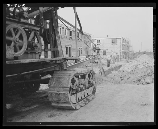 Defense housing, Erie, Pennsylvania. This machine digs several feet of ditch for piping an hour. The job would require many days by hand